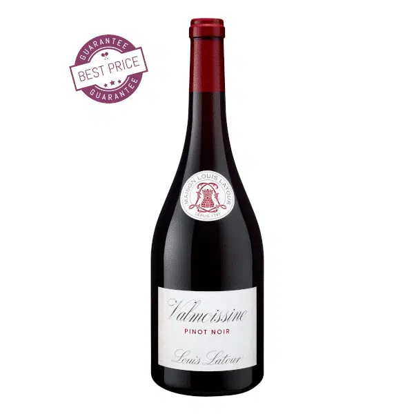 A sleek bottle of Louis Latour Valmoissine Pinot Noir 2023 placed beside a filled wine glass, showcasing its ruby hue—set against a soft, neutral background that hints at the French countryside and the wine’s refined character.