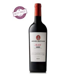 A bottle of Heritage Cahors Malbec 2021 with an elegant label, showcasing French craftsmanship against a rustic background.