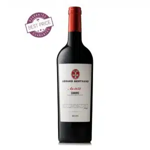 A bottle of Heritage Cahors Malbec 2021 with an elegant label, showcasing French craftsmanship against a rustic background.