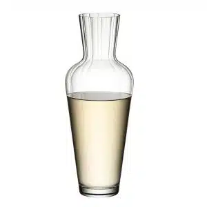 Crystal-clear Riedel Wine Friendly Decanter on a wooden table, filled with red wine – available at The Wine Box.