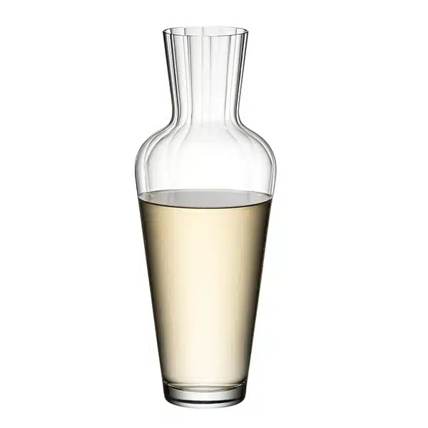 Crystal-clear Riedel Wine Friendly Decanter on a wooden table, filled with red wine – available at The Wine Box.